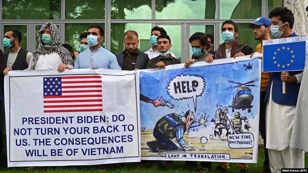 Afghan former interpreters for the U.S. and NATO forces gather during a demonstration in downtown Kabul on April 30.