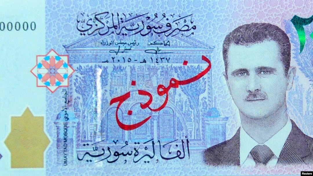 A portrait of Syria's President Bashar al-Assad is seen on the new Syrian 2,000-pound banknote.