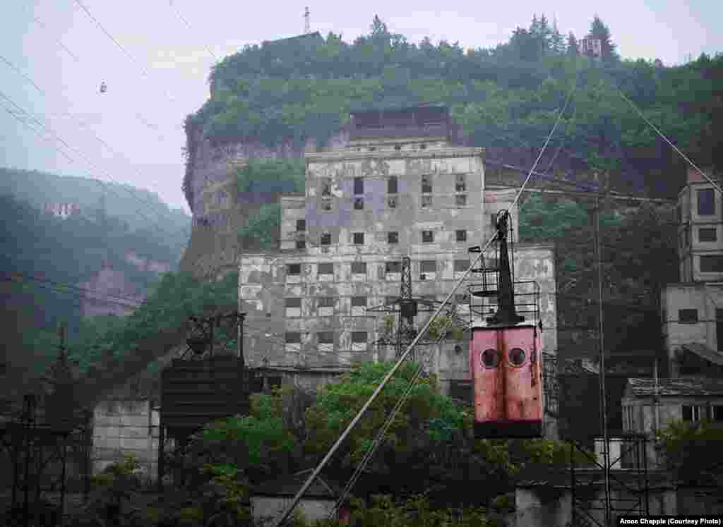 At the eastern edge of Chiatura, this manganese processing plant next to a mine shaft operates 24 hours a day. Workers access the mine by taking two tramways up and over steep bluffs. The second tramway is visible at top left. 