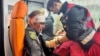 A medical worker treats a wounded police officer in an ambulance at a site of a Russian missile strike in Kharkiv on November 1.