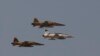 File photo:Iranian fighter jets fly over the mausoleum of late revolutionary founder Ayatollah Khomeini, during a military parade ceremony marking the 29th anniversary of the start of the 1980-1988 Iraq-Iran war, just outside Tehran, Iran, Tuesday, Sept. 