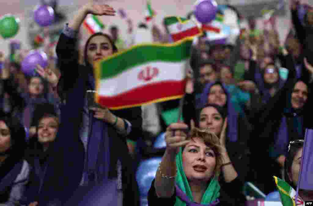 Supporters of Iranian president and presidential candidate Hassan Rohani chant slogans during an election-campaign rally in the northwestern city of Zanjan on May 16. (AFP/Behrouz Mehri)