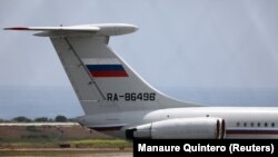 An airplane with the Russian flag is seen at Simon Bolivar International Airport in Caracas, June 24, 2019