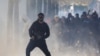 Një protestues reagon përballë policisë kundër trazirave gjatë protestës studentore kundër Qeverisë, në Tiranë, Shqipëri, më 17 tetor 2026.