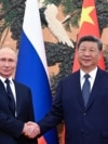 Russian President Vladimir Putin shakes hands with Chinese leader Xi Jinping during a meeting at The Great Hall of the People in Beijing in September 2025.