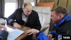 Президент России Владимир Путин и Роман Старовойт (архивное фото).