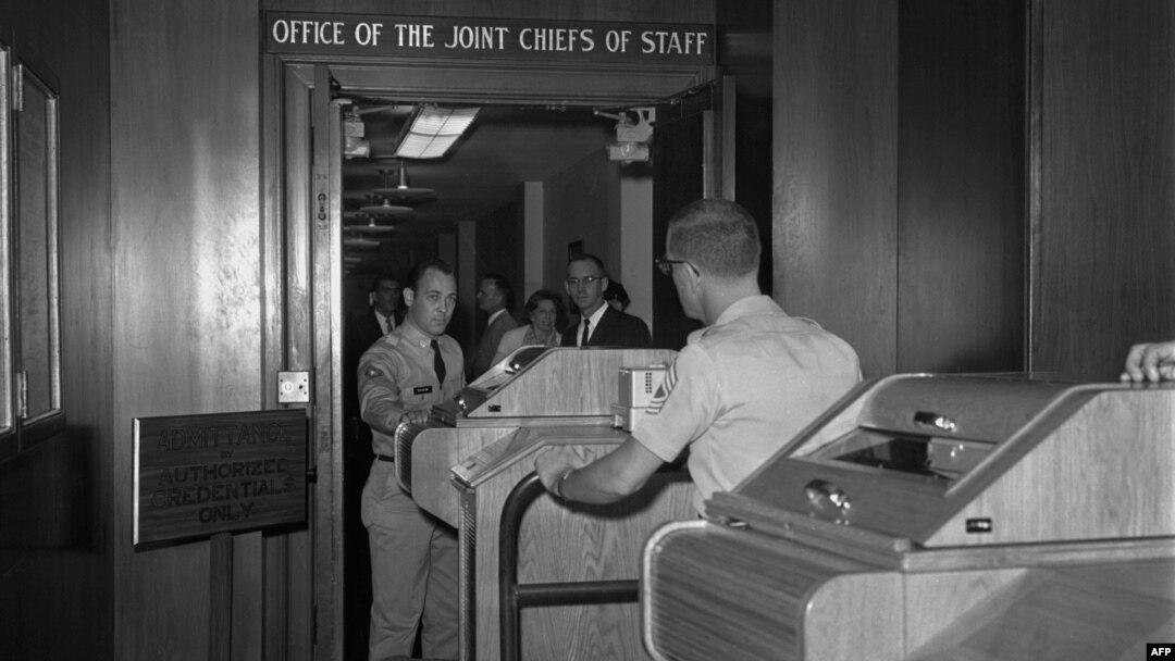 Employees install equipment for the hotline in the White House in August 1963.