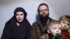 An image from a video posted by the Taliban on social media last year shows American Caitlan Coleman (left) with her Canadian husband, Joshua Boyle, and two of their sons.