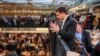 Volodymyr Zelenskiy speaks to someone below during his "press marathon" at a food market in Kyiv on October 10.