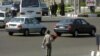 A boy sells flowers in northern Tehran, Iran. File photo