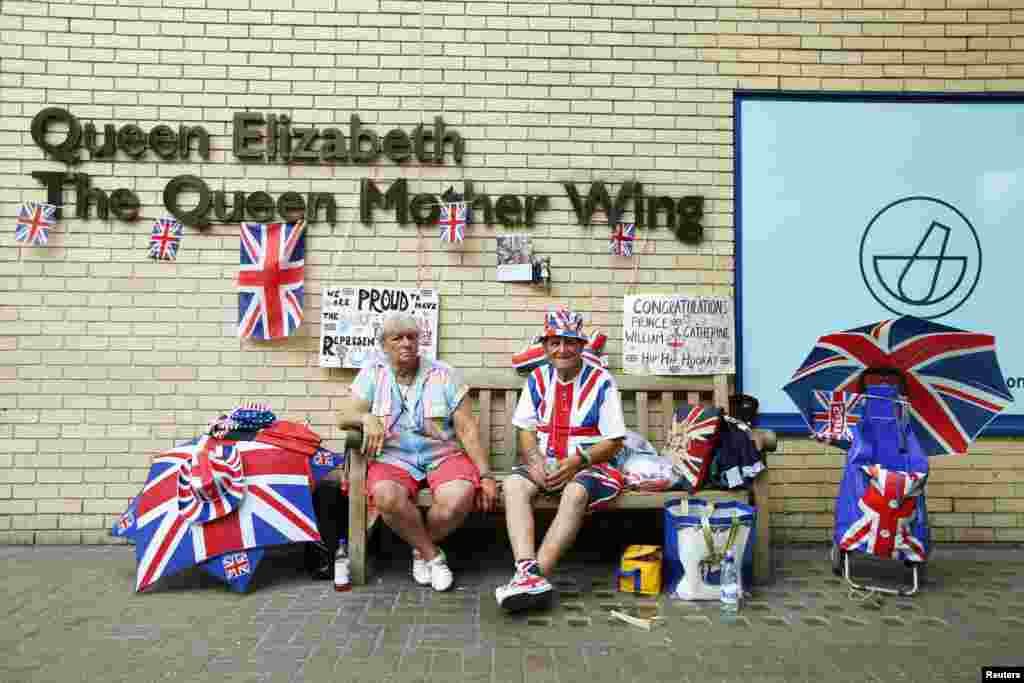 Fans of the royal family wait outside.