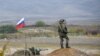 NAGORNO-KARABAKH -- A Russian peacekeeper patrols at a checkpoint outside Askeran, November 20, 2020