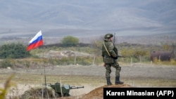 NAGORNO-KARABAKH -- A Russian peacekeeper patrols at a checkpoint outside Askeran, November 20, 2020