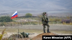 NAGORNO-KARABAKH -- A Russian peacekeeper patrols at the check point outside Askeran, November 20, 2020