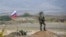 NAGORNO-KARABAKH -- A Russian peacekeeper patrols at the check point outside Askeran, November 20, 2020