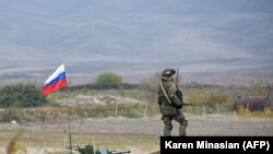 A Russian peacekeeper patrols at the check point outside Askeran in Nagorno-Karabakh (file photo).