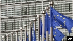 Belgium -- EU flags fly at the European Commission headquarters in Brussels, 09May2011