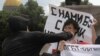 A man attacks a gay rights activist during an unsanctioned gay pride parade in St. Petersburg in June.