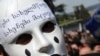 Georgia -- A masked activist at an anti-Saakashvili rally in front of the parliament building in Tbilisi, 13Apr2009