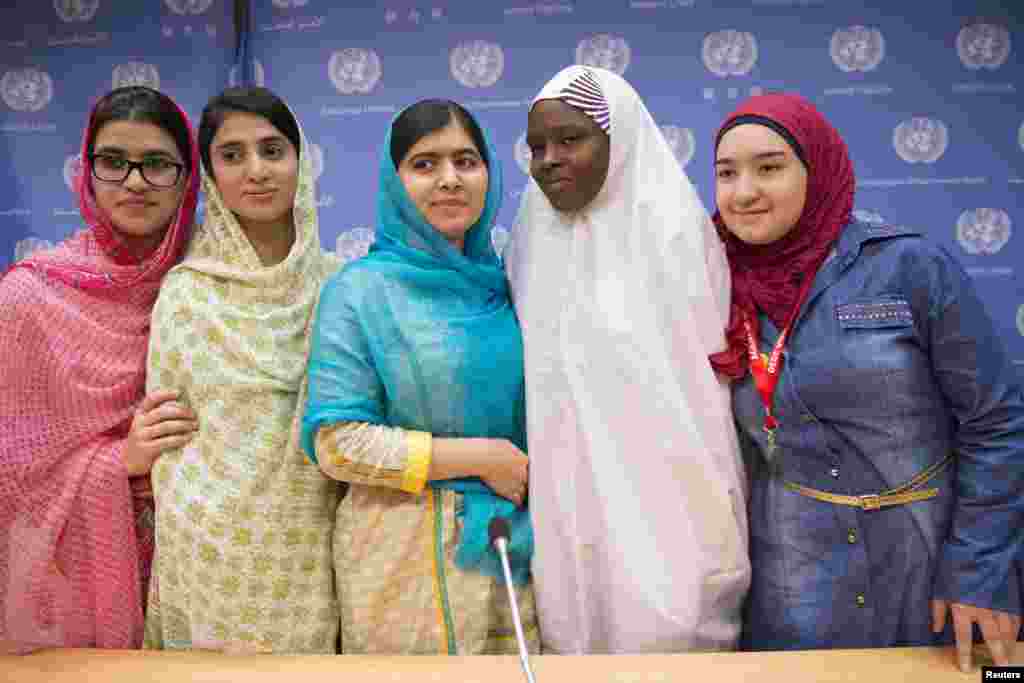 Nobel Peace Prize laureate Malala Yousafzai (center) of Pakistan and her friends and fellow activists smile at a news conference after speaking at the UN General Assembly in New York on September 25.​ Malala called on world leaders to do more about the Syrian crisis, saying that the drowning of a toddler showed the world had &quot;lost humanity.&quot;