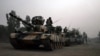 FILE: Pakistani army tanks form a column during a ground military operation in Miran Shah, the main town in North Waziristan.