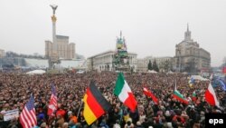 Ukraine -- Representatives of different countries carry their flags as Ukrainians attend a rally on Independence Square in Kyiv, March 2, 2014