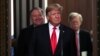 U.S. President Donald Trump arrives flanked by Secretary of State Mike Pompeo (L) and U.S. National Security Advisor John Bolton (R). File photo