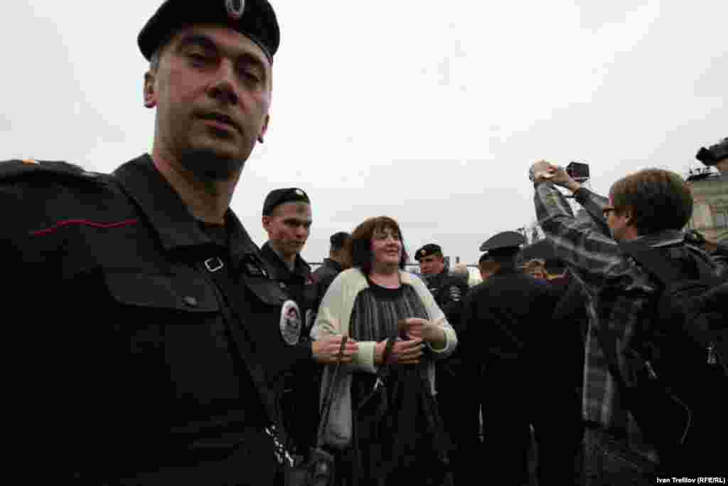 Mityushkina is led away by police.