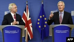 EU negotiator Michel Barnier (right) speaks as Britain's Brexit Minister David Davis listens on June 19.