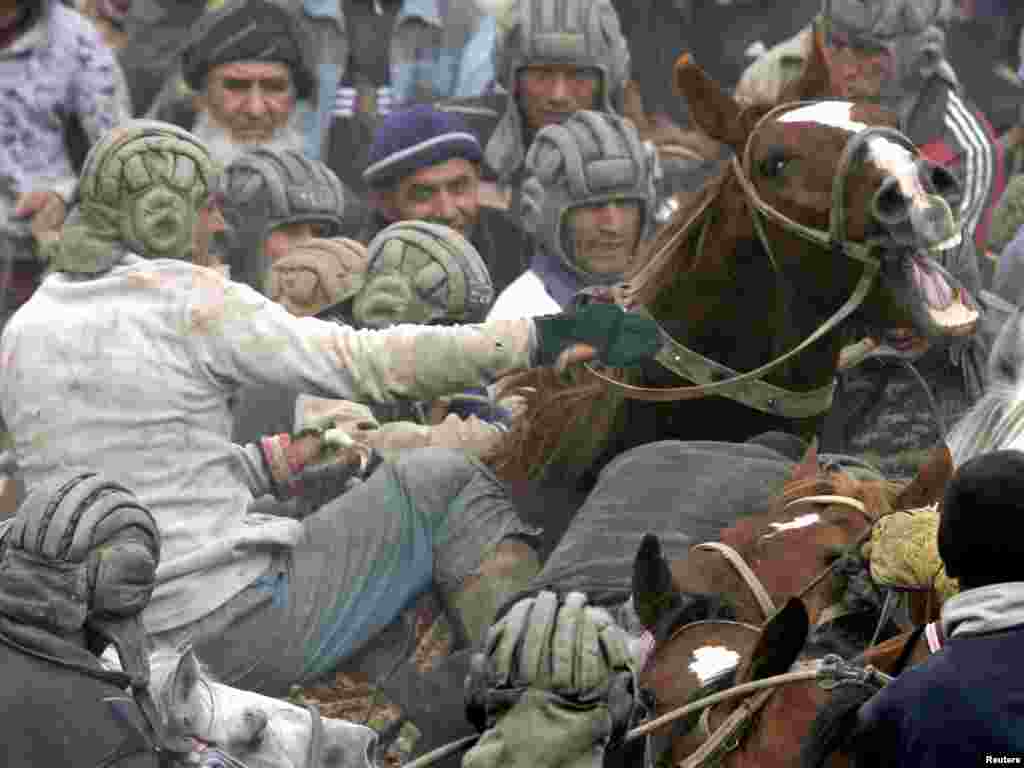 Men on horseback compete in goat dragging, a traditional Central Asian sport, outside the Tajik capital of DushanbePhoto by Nozim Kalandarov for Reuters