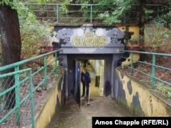 A worker sweeps the entrance to the Folimanka shelter in Prague during an open day on September 14.