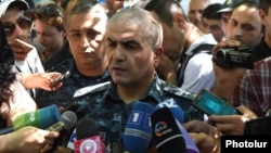 Armenia - General Hunan Poghosian, the first deputy chief of the Armenian police, speaks to reporters near a police building in Yerevan seized by anti-government gunmen, 17Jul2016.