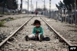 A child plays on a rail track at the Greek-Macedonian border near the Greek village of Idomeni on March 7.