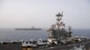 The aircraft carrier USS Abraham Lincoln (CVN 72), back, steams alongside the aircraft carrier USS John C. Stennis (CVN 74) in the Mediterranean Sea, April 24, 2019