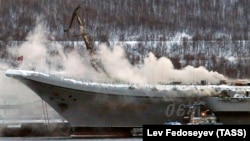 Smoke rises from Russia's only aircraft carrier, the Admiral Kuznetsov, in Murmansk on December 12.