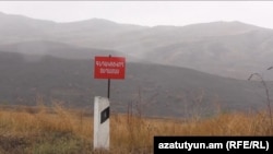 Armenia- A sign in Tavush province warning of cross-border gunfire from Azerbaijan. 