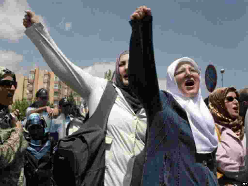 Antisecular demonstrations in Turkey - Demonstrators shout during a protest on June 6, 2008 in Ankara in front of the Constitutional Court a day after the court annulled a law allowing women to wear Islamic headscarves at universities. Prime Minister Recep Tayyip Erdogan convened an emergency meeting with senior aides on June 6 after Turkey's top court upheld a ban on the Islamic headscarf in universities, dampening his party's hopes of surviving a pending closure case. 