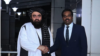 د طالبانو د حکومت د بهرنیوچارو وزیر امیرخان متقي (کیڼ لوري ته)