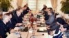 Pakistani Prime Minister Shahid Khaqan Abbasi (center-right) talks with U.S. Secretary of Defense Jim Mattis (center-left) during their meeting in Islamabad on December 4.