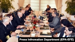 Pakistani Prime Minister Shahid Khaqan Abbasi (center-right) talks with U.S. Secretary of Defense Jim Mattis (center-left) during their meeting in Islamabad on December 4.