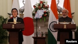 Japanese Prime Minister Fumio Kishida (left) and Indian Prime Minister Narendra Modi speak to the media in New Delhi on March 19.