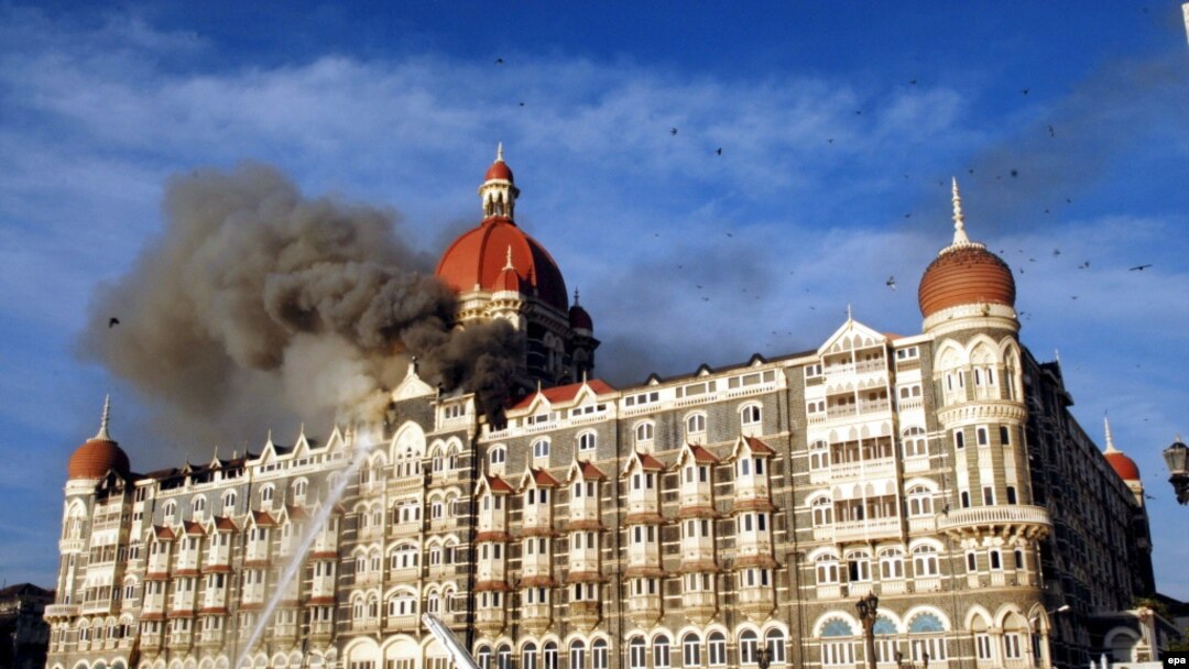 Firefighters try to douse a fire at the Taj hotel in Mumbai amid a deadly attack in November 2008.