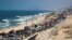 Displaced Palestinians move southward after Israeli forces ordered residents of Gaza City to evacuate to the south