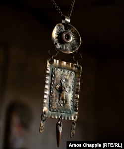 This crucifix pendant was crafted from a sniper round.