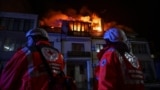 Red Cross emergency workers stand by an apartment building hit by a Russian drone strike in Zaporizhzhya, Ukraine, on March 1.