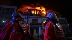 Red Cross emergency workers stand by an apartment building hit by a Russian drone strike in Zaporizhzhya, Ukraine, on March 1.