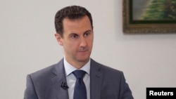 Syrian President Bashar al-Assad downplayed the significance of Saudi- and Western-backed opposition forces in Syria -- saying it was important for what he called "real" opposition groups participate. (file photo)