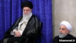 President Hassan Rouhani (right) sitting close to Supreme Leader, Ayatollah Ali Khamenei, May 14, 2019.