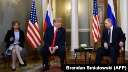 U.S. President Donald Trump (center) last met with Russian President Vladimir Putin in a one-on-one setting in Helsinki in July 2018.