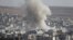 Smoke rises after a U.S.-led air strike on Islamic State positions in the Syrian town of Kobani on October 10.